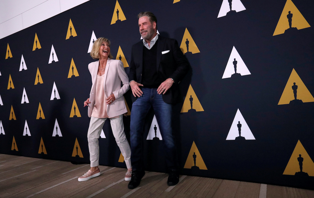 Cast members John Travolta and Olivia Newton-John dance at a 40th anniversary screening of u00e2u20acu02dcGreaseu00e2u20acu2122 at the Academy of Motion Picture Arts and Sciences in Beverly Hills, California, US, August 15, 2018. u00e2u20acu201d Reuters picnn