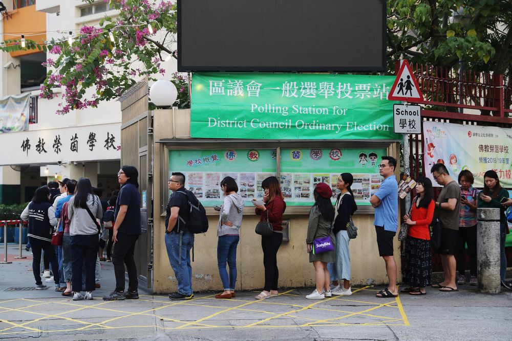 Voters queue up outside a polling station during district council local elections in Hong Kong, China November 24, 2019. u00e2u20acu201d Reuters pic