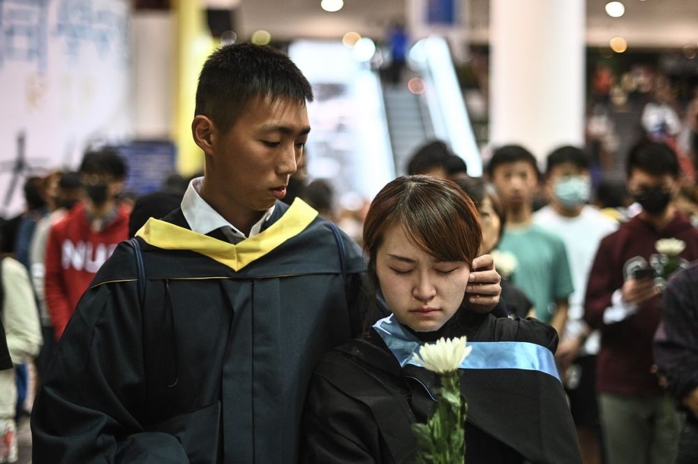 Students take part in a vigil at the Hong Kong University of Science and Technology (HKUST) in Hong Kong on November 8, 2019 for student Alex Chow, 22, who died earlier in the day. u00e2u20acu201d AFP pic