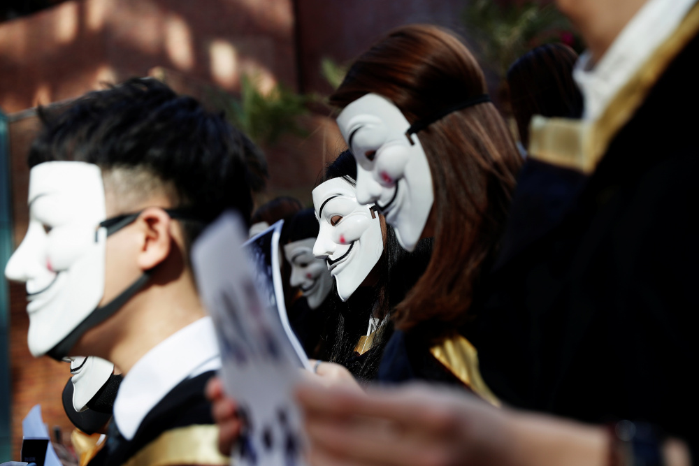 University students wearing Guy Fawkes masks pose during a news conference to support anti-government protests before their graduation ceremony at the Hong Kong Polytechnic University in Hong Kong, China, November 5, 2019. u00e2u20acu201d Reuters pic