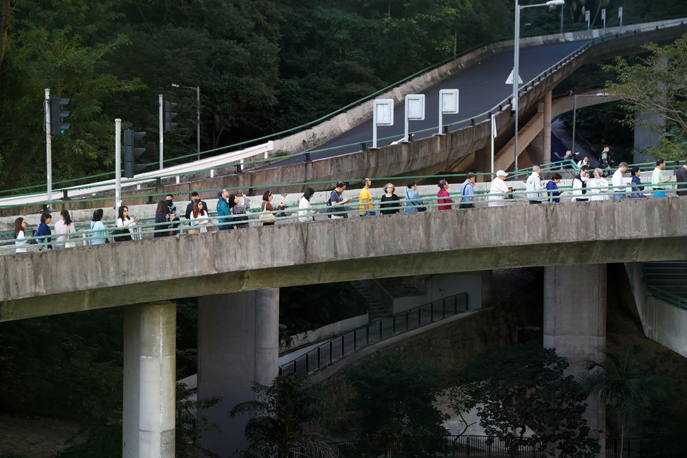 Voters queue up to cast their vote at a polling station during district council local elections in Hong Kong, China November 24, 2019. u00e2u20acu201d Reuters pic