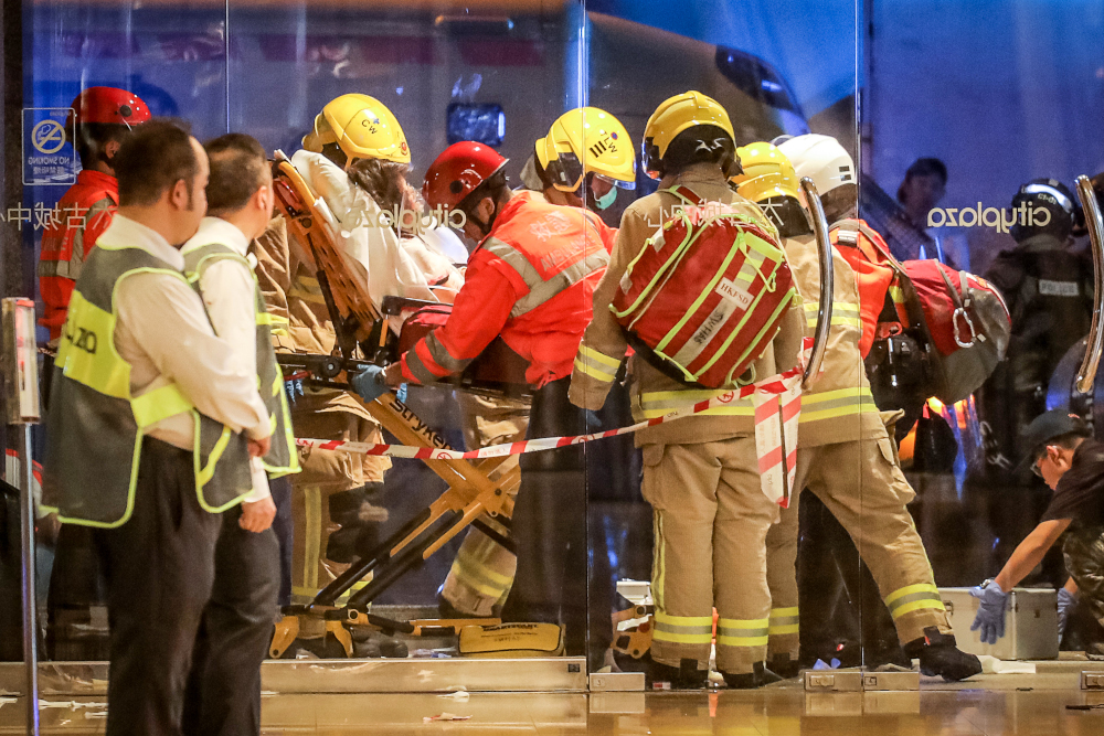 Paramedics carry away a wounded person on a stretcher after a bloody knife fight broke out at a shopping mall in Hong Kong November 3, 2019. u00e2u20acu201d AFP pic 
