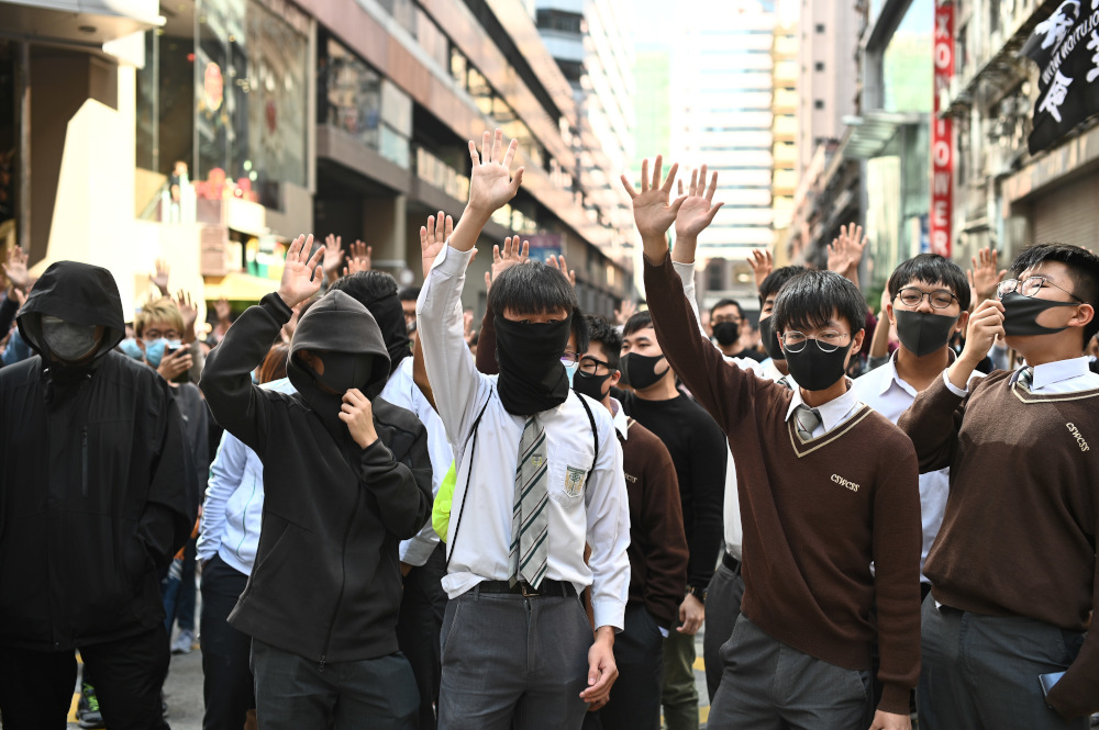 High school students gesture and chant slogans during a lunchtime flash mob rally in the Cheung Sha Wan district in Hong Kong November 29, 2019. u00e2u20acu201d AFP pic 