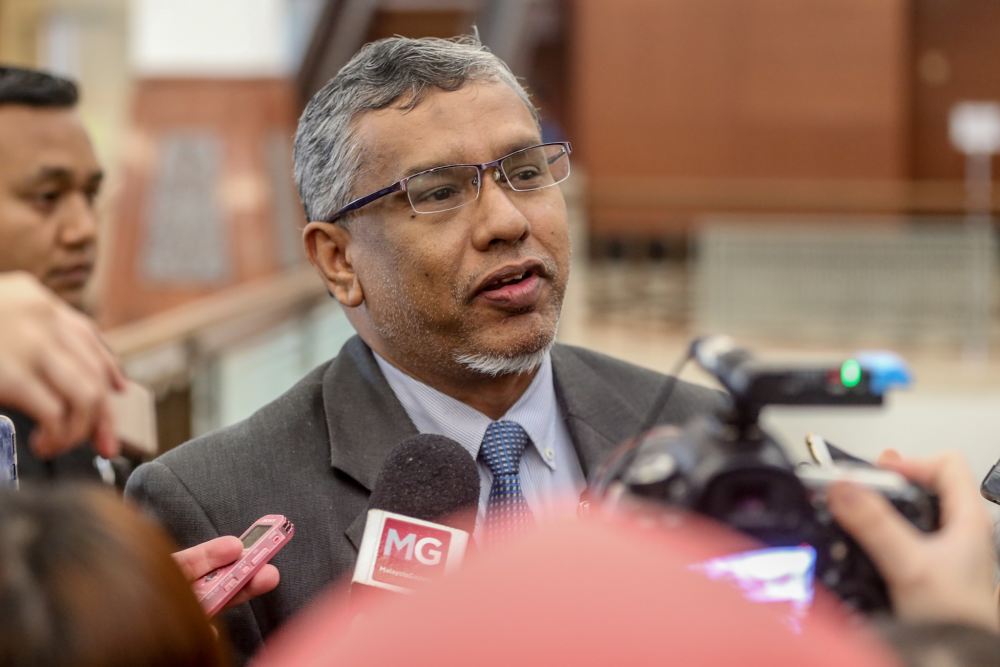 Minister in the Prime Minister's Department Hanipah Maidin speaks to reporters at the Parliament lobby in Kuala Lumpur November 27, 2019. u00e2u20acu2022 Picture by Firdaus Latif