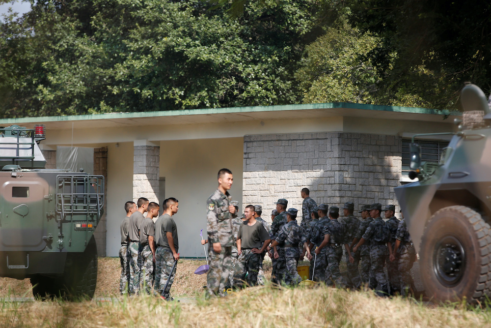 Peopleu00e2u20acu2122s  Liberation Army (PLA) vehicles and troops are seen inside the Tam Mei PLA base in Hong Kongu00e2u20acu2122s northern New Territories, China November 16, 2019. u00e2u20acu201d Reuters picnn