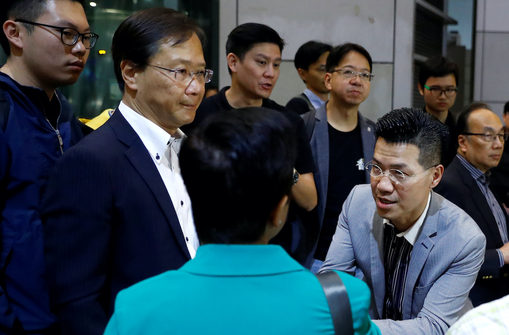 Hong Kong lawmaker Gary Fan greets a pro-democracy activist next to lawmaker Kwok Ka-Ki before entering police headquarters after being notified of their arrest in Hong Kong, China, November 9, 2019. u00e2u20acu201d Reuters picnn