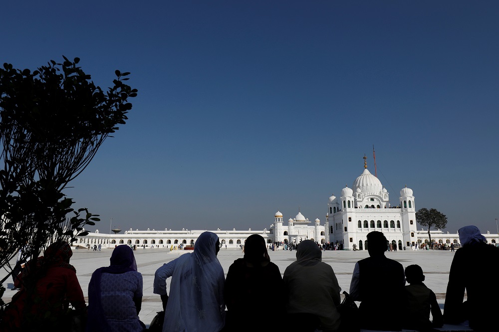 Indian Sikh pilgrims are silhouetted as they visit the Gurdwara Darbar Sahib in Kartarpur, Pakistan November 9, 2019. — Reuters pic 