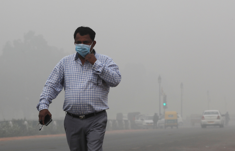 A man wearing a mask walks on a smoggy morning in New Delhi, November 3, 2019. u00e2u20acu201d Reuters pic 