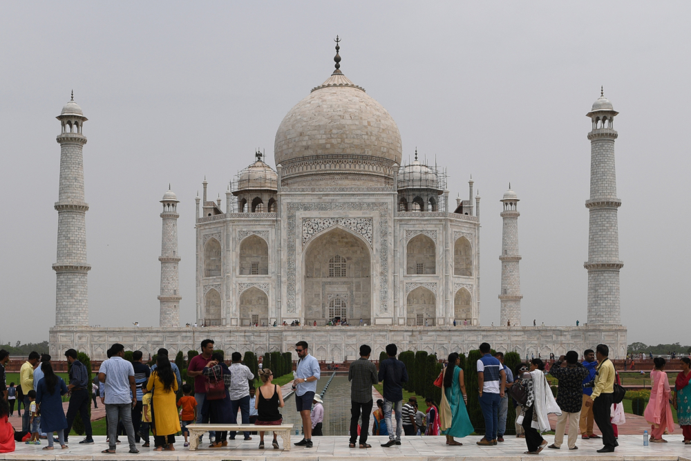Tourists visiting the Taj Mahal in Agra. u00e2u20acu201d AFP pic