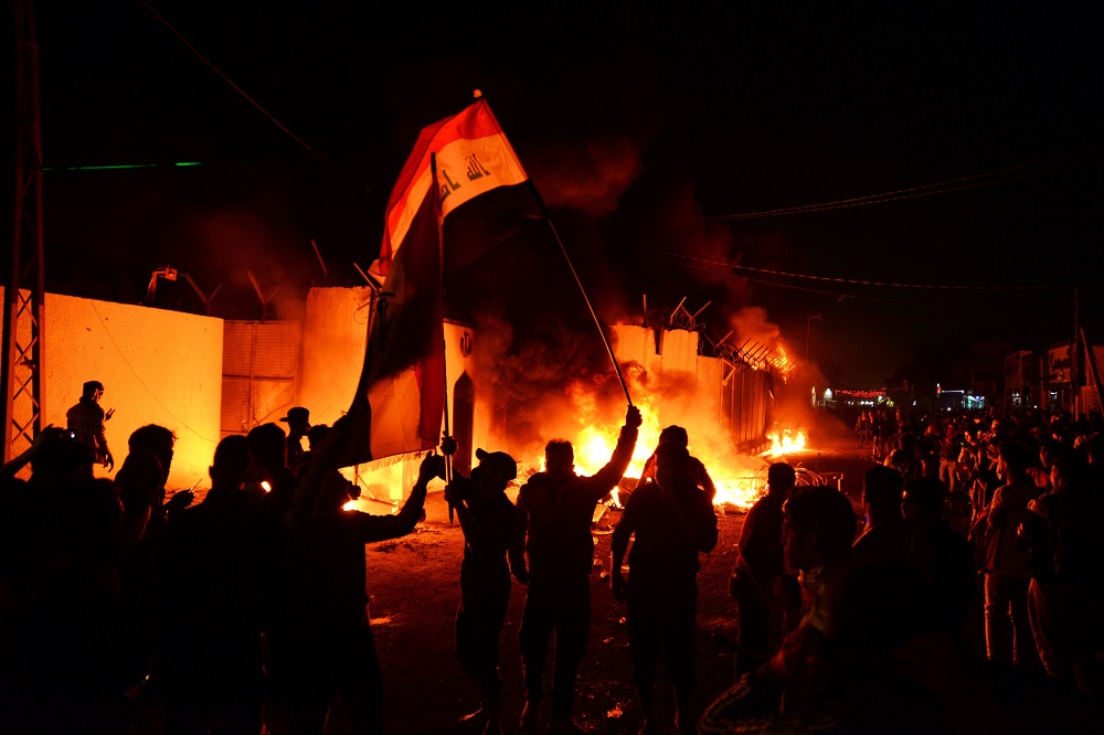 Iraqi demonstrators gather as flames start consuming Iran's consulate in the southern Iraqi Shiah holy city of Najaf on November 27, 2019, two months into the countryu00e2u20acu2122s most serious social crisis in decades. u00e2u20acu2022 AFP pic
