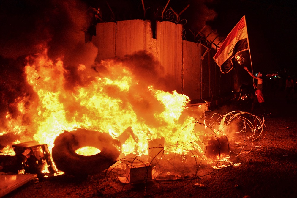 Iraqi demonstrators gather as flames start consuming Iranu00e2u20acu2122s consulate in the southern of Najaf on November 27, 2019, two months into the countryu00e2u20acu2122s most serious social crisis in decades. u00e2u20acu2022 AFP pic