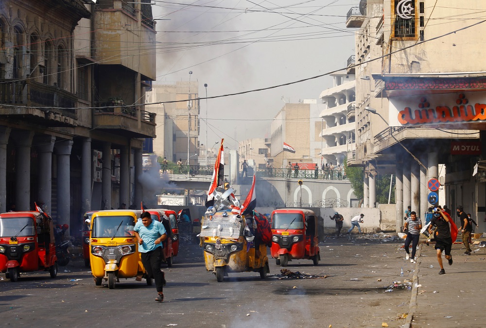 Demonstrators run as they clash with members of Iraqi security forces during the ongoing anti-government protests in Baghdad, Iraq November 10, 2019. u00e2u20acu201d Reuters pic 