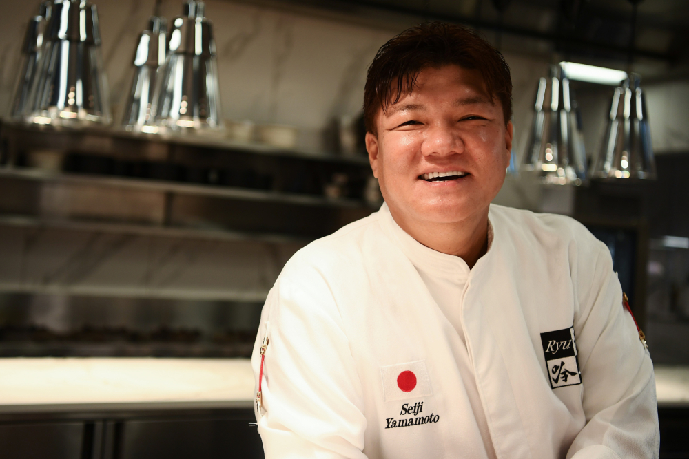 Japanese chef Seiji Yamamoto poses in the kitchen of his restaurant Ryugin in Tokyo. u00e2u20acu201d AFP pic 