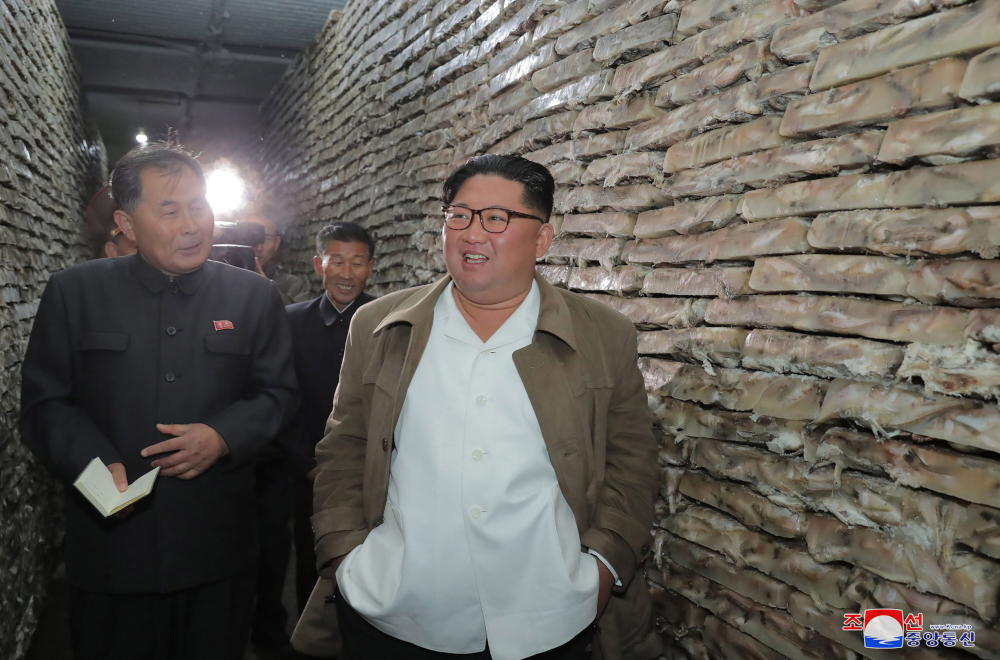 This undated picture released from North Koreau00e2u20acu2122s KCNA November 19, 2019 shows North Korean leader Kim Jong-un (right) visiting a fishery station at an undisclosed location in North Korea. u00e2u20acu201d KCNA via KNS handout pic via AFP