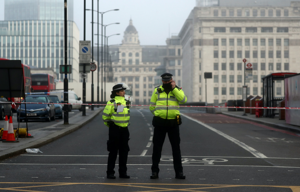 Police officers stand behind cordon at the scene of a stabbing on London Bridge, in which two people were killed, in London, Britain, November 30, 2019. u00e2u20acu201d AFPnn