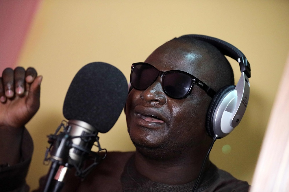 Yahaya Usman, popularly called Yahaya Makaho, a blind singer who rose from being a street beggar to a famously known singer in northern Nigeria, sings while wearing his trademark sunglasses in Kaduna, Nigeria, on September 25, 2019. u00e2u20acu201d AFP pic