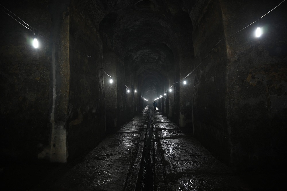 In this photo taken on November 6, 2019, a worker walks inside at the El Deposito, a Spanish-era water reservoir being rehabilitated for tourism, in San Juan town, suburban Manila. u00e2u20acu201d AFP pic