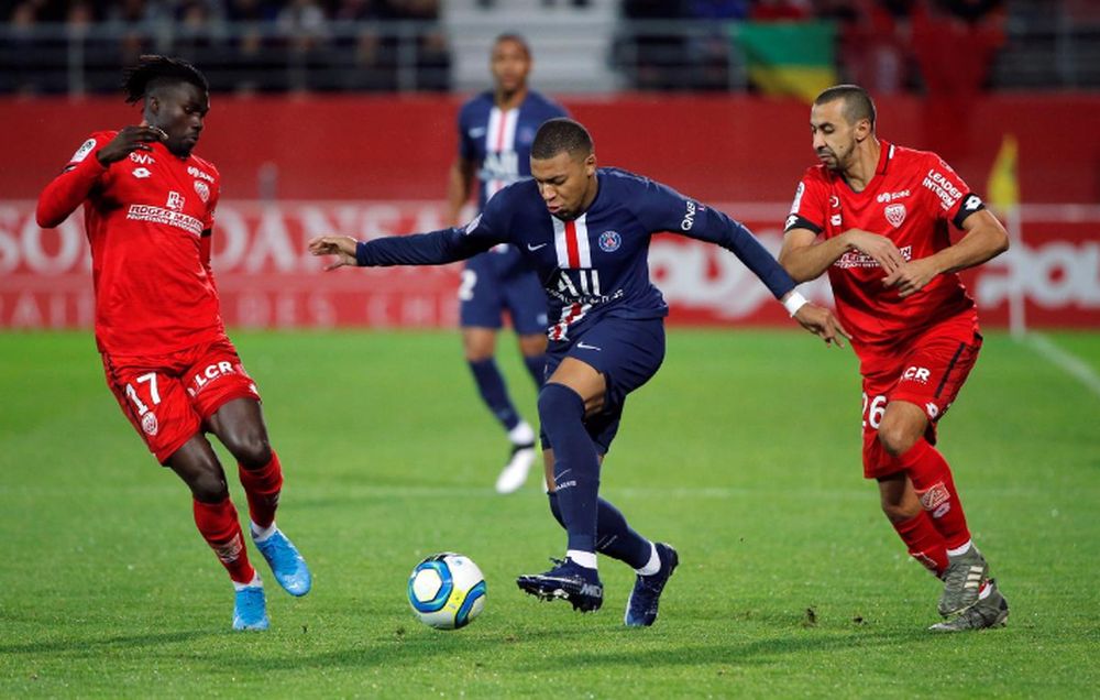 Paris St Germainu00e2u20acu2122s Kylian Mbappe in action with Dijonu00e2u20acu2122s Mama Balde during their Ligue 1 match at Stade Gaston Gerard, Dijon, France, November 1, 2019. u00e2u20acu201d Reuters pic
