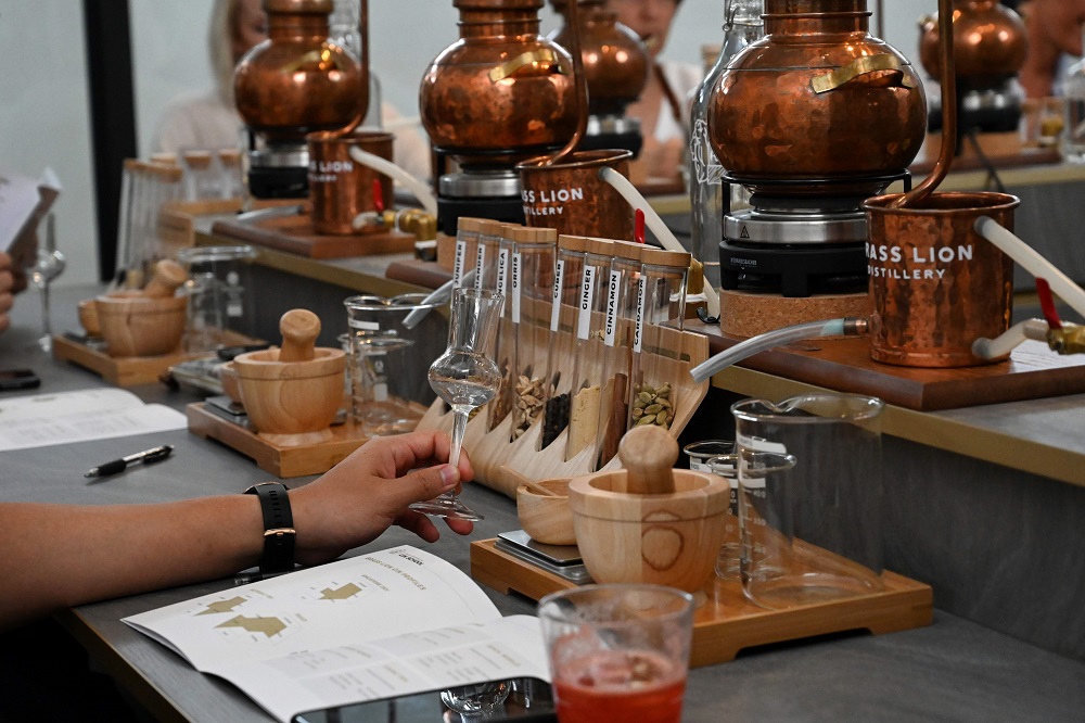 In this photo taken on October 13, 2019, participants attend a gin-making course at the Brass Lion Distillery in Singapore. u00e2u20acu201d AFP pic  
