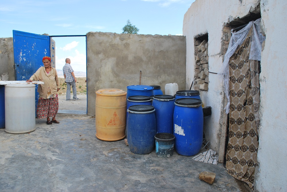 Plastic cylinders of water on one side of the farmhouse courtyard are for agriculture, while the others contain water for use by the 11 members of the Barhoumi family in Kairouan, Tunisia September 2, 2019. —Thomson Reuters Foundation pic