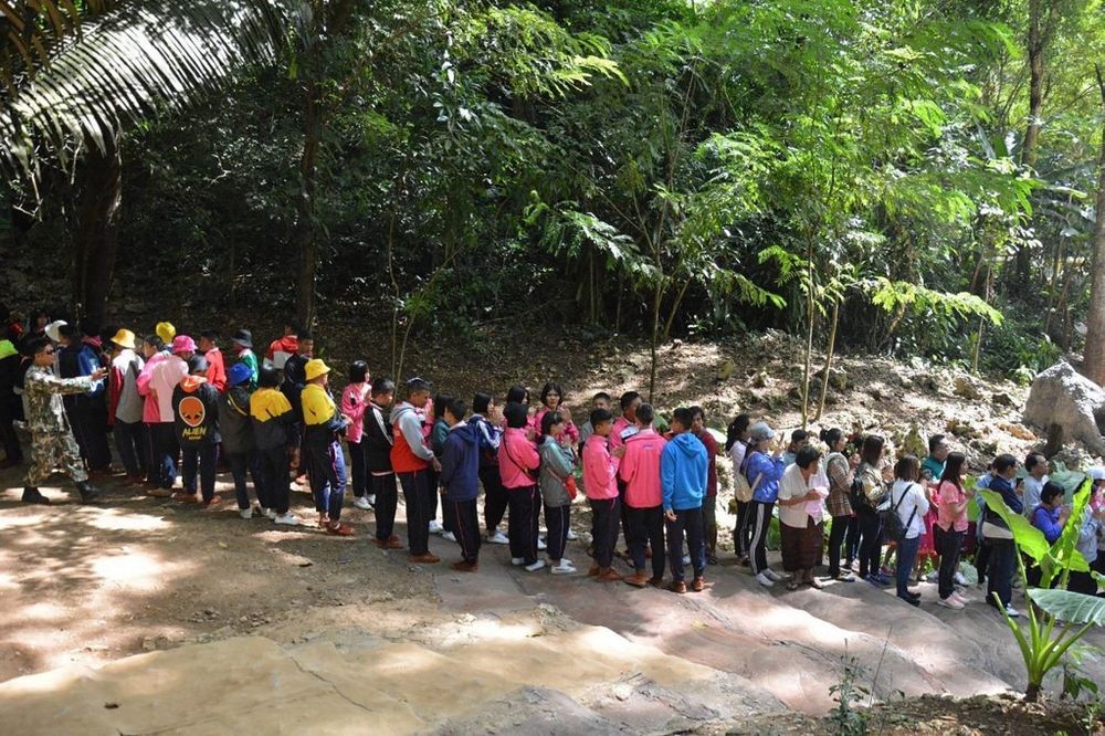 Handout photo released by Chiang Rai Provincial Public Relations Office shows people waiting in a queue to visit Tham Luang cave in Thailand's northern Chiang Rai province, November 1, 2019. u00e2u20acu201d AFP pic