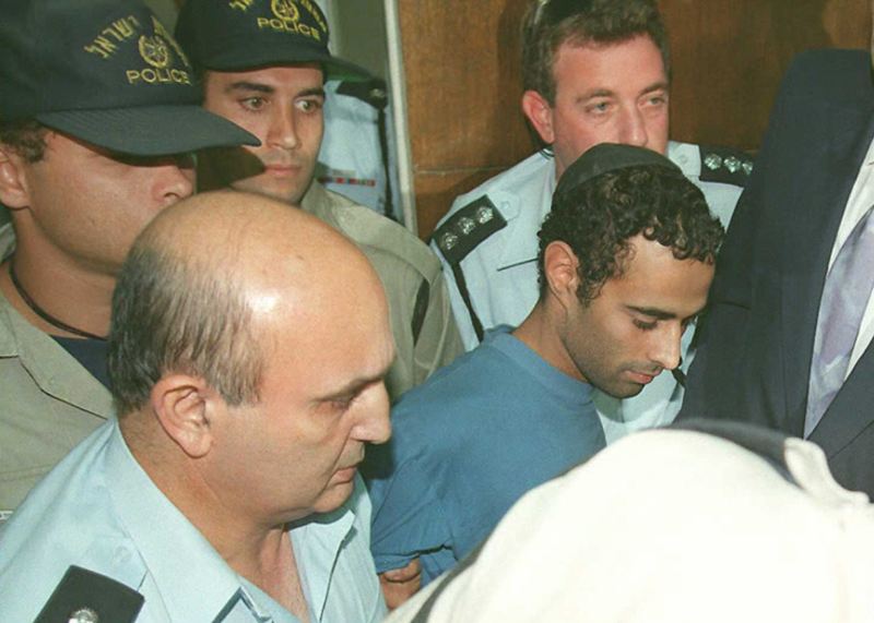 Israeli Yigal Amir (centre),the admitted killer of Israeli Premier Yitzhak Rabin, being escorted to the Tel Aviv court. u00e2u20acu2022 AFP pic