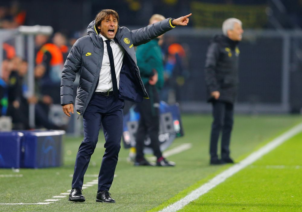 Inter Milan coach Antonio Conte gestures to his team during the Uefa Champions League match against Borussia Dortmund. u00e2u20acu201d Reuters pic