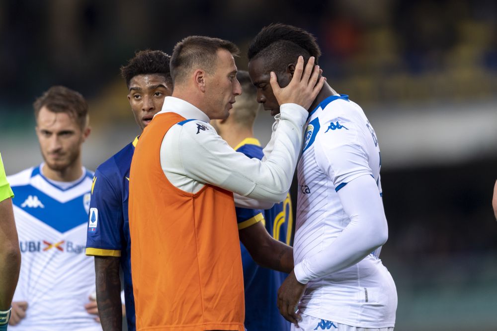 Bresciau00e2u20acu2122s Daniele Gastaldello talks to teammate Mario Balotelli following racist chants against the latter during the match against Verona. u00e2u20acu201d Reuters pic