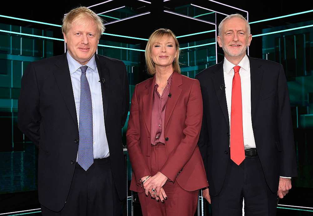 (From left) Conservative leader Boris Johnson, Julie Etchingham and Labour leader Jeremy Corbyn prior to a televised debate between Johnson and Corbyn in London November 19, 2019. u00e2u20acu201d Jonathan Hordle/ITV handout via Reuters