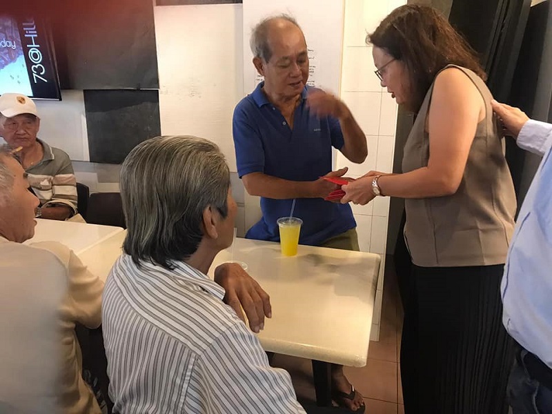 The 36 senior citizens received angpow packets during the birthday celebration. — Picture from Facebook/Happy People Helping People