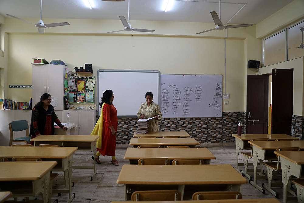 Teachers talk to each other in an empty classroom of a school after it remained closed on account of smog in New Delhi, India November 14, 2019. u00e2u20acu201d Reuters pic