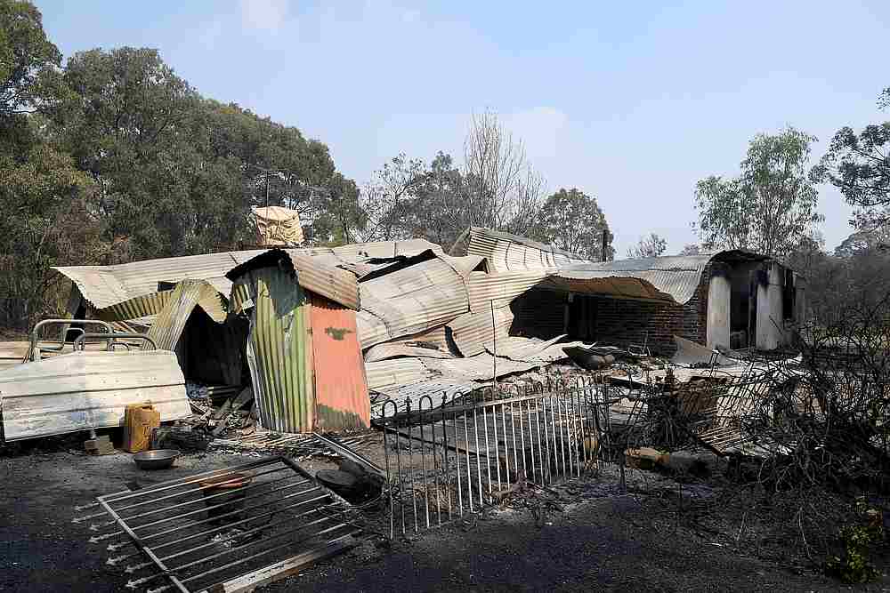 A property is destroyed by fire near Colo Heights, northwest of Sydney November 16, 2019. u00e2u20acu201d AAP Image/Dan Himbrechts via Reuters