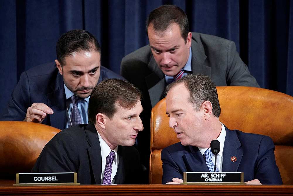 House Intelligence Committee Chairman Adam Schiff (right) speaks with Democratic counsel Daniel Goldman and other staffers during testimony before a committee hearing in Washington November 15, 2019. u00e2u20acu201d Reuters/Joshua Roberts pool pic