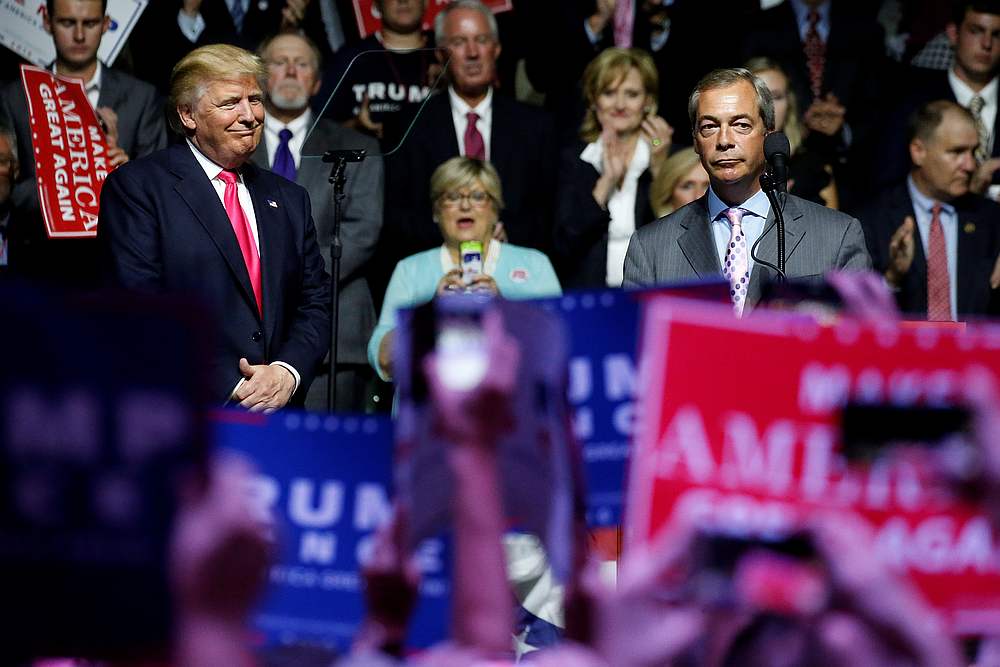 Then US presidential candidate Donald Trump (left) watches as British pro-Brexit politician Nigel Farage speaks at a campaign rally in Jackson, Mississippi, August 24, 2016. u00e2u20acu201d Reuters pic