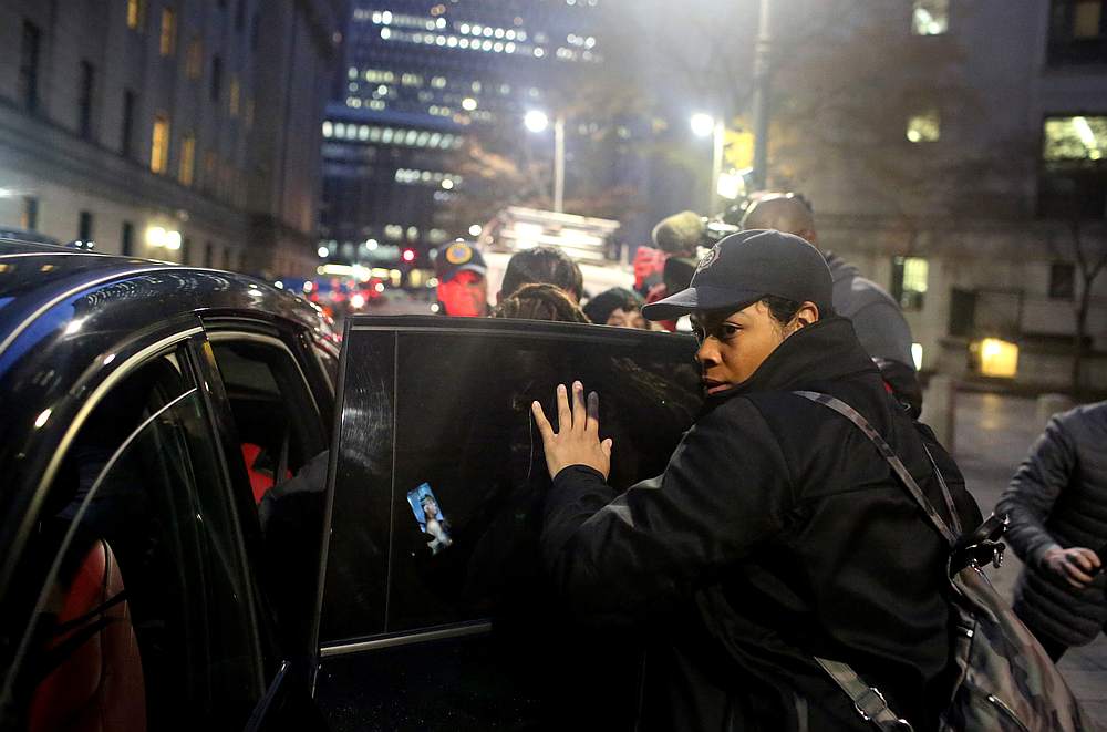 A scrum around Tova Noel and Michael Thomas, charged in an indictment with making false records and conspiracy the night financier Jeffrey Epstein killed himself, while leaving the Federal Court in New York November 19, 2019. u00e2u20acu201d Reuters pic