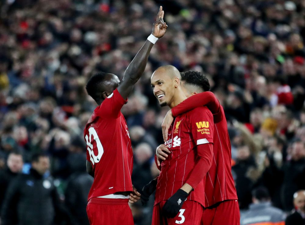Liverpool's Fabinho (centre) celebrates scoring their first goal with Sadio Mane and Roberto Firmino. u00e2u20acu201d Reuters pic