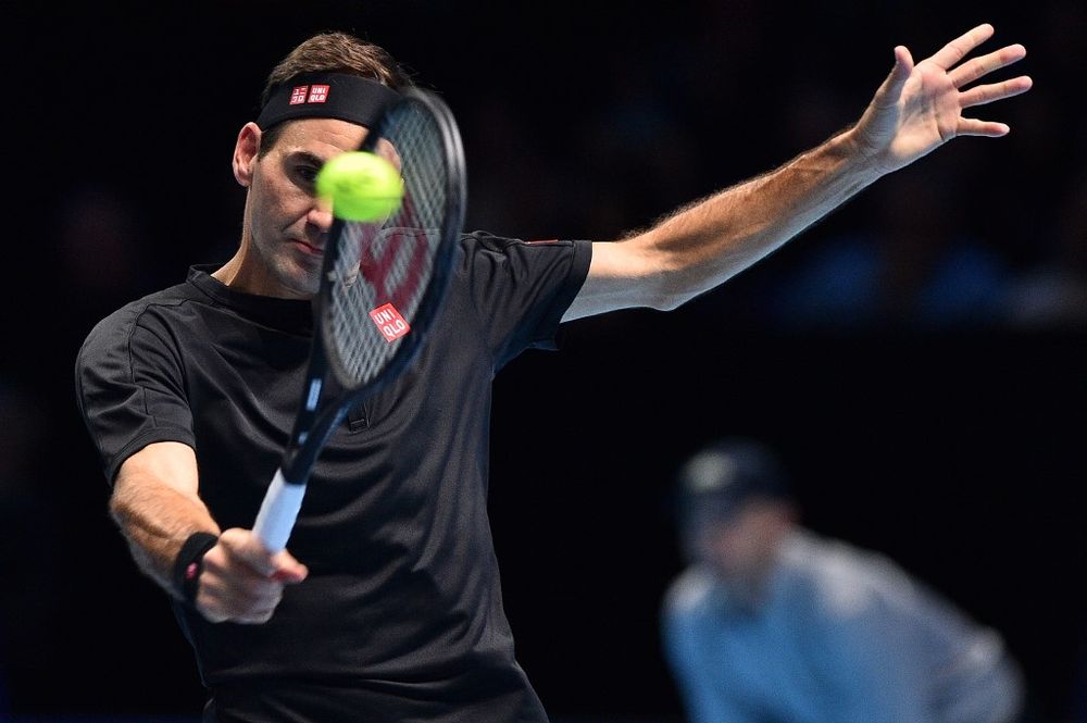 Roger Federer returns against Matteo Berrettini during their menu00e2u20acu2122s singles round-robin match on day three of the ATP World Tour Finals tennis tournament at the O2 Arena in London on November 12, 2019. Federer won the match 7-6, 6-3. u00e2u20acu201d AFP pic
