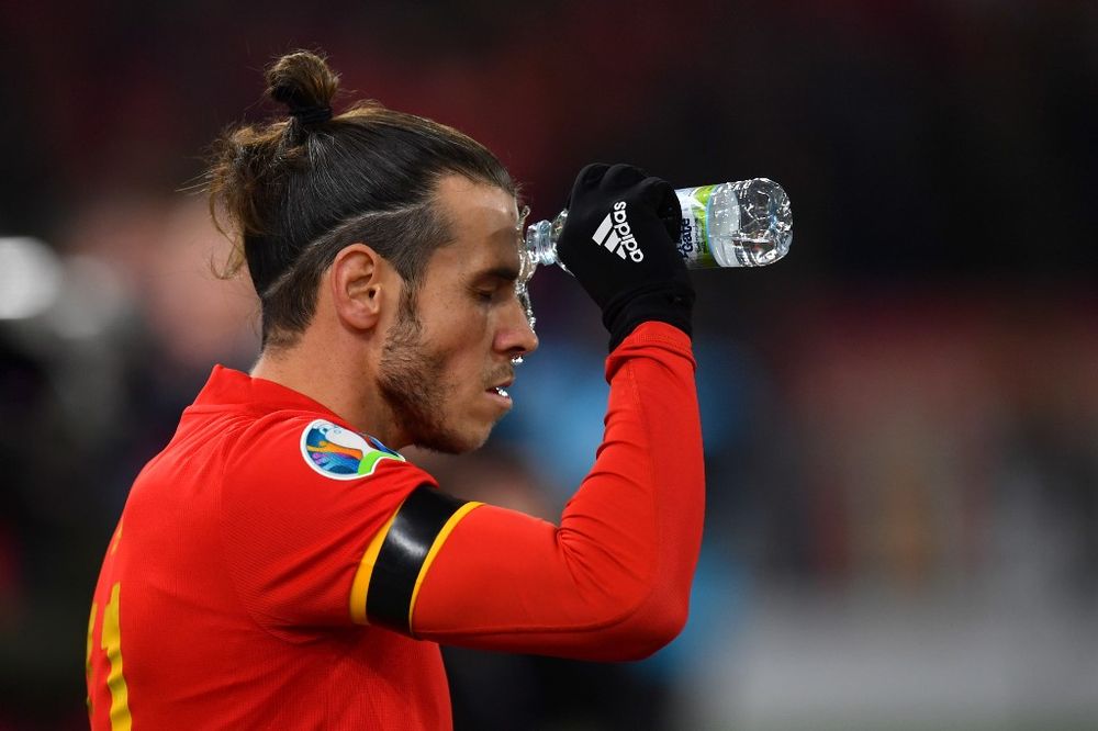 Walesu00e2u20acu2122 forward Gareth Bale sprinkles water during the Group E Euro 2020 qualification match between Wales and Hungary at Cardiff City Stadium in Cardiff, Wales on November 19, 2019. u00e2u20acu201d AFP pic