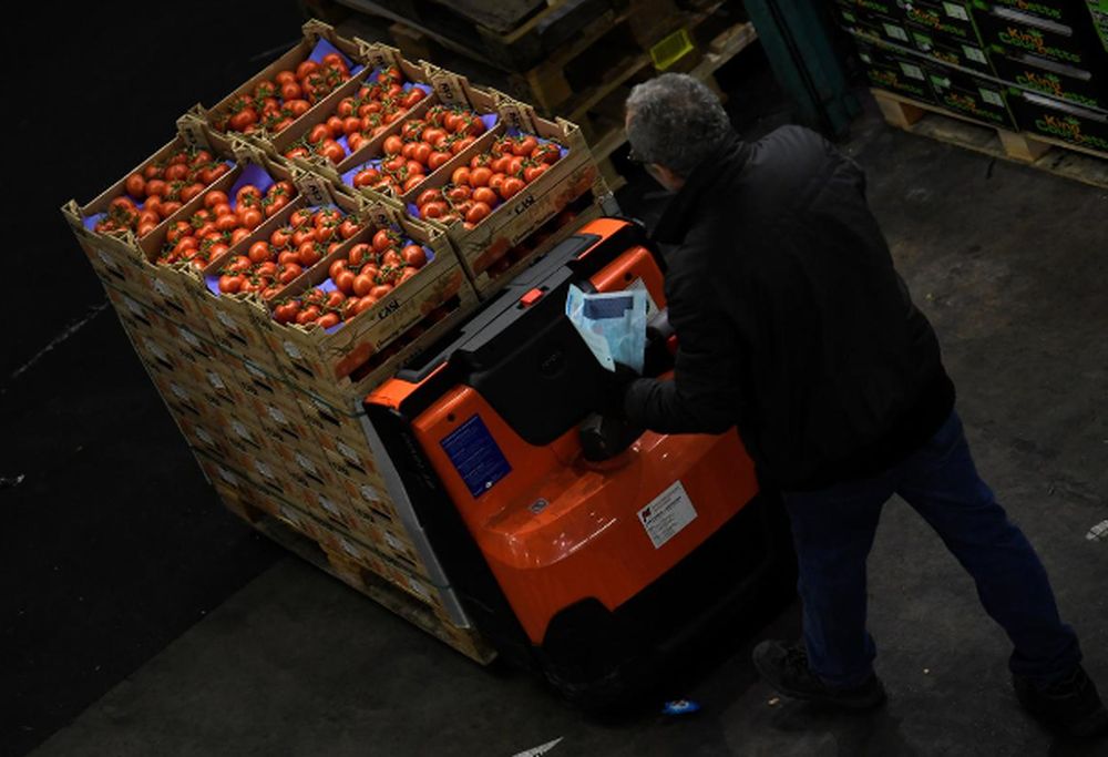 A worker moves some tomatoes at the wholesale fruits and vegetables market in Hamburg Germany March 13, 2018. u00e2u20acu201d Reuters pic