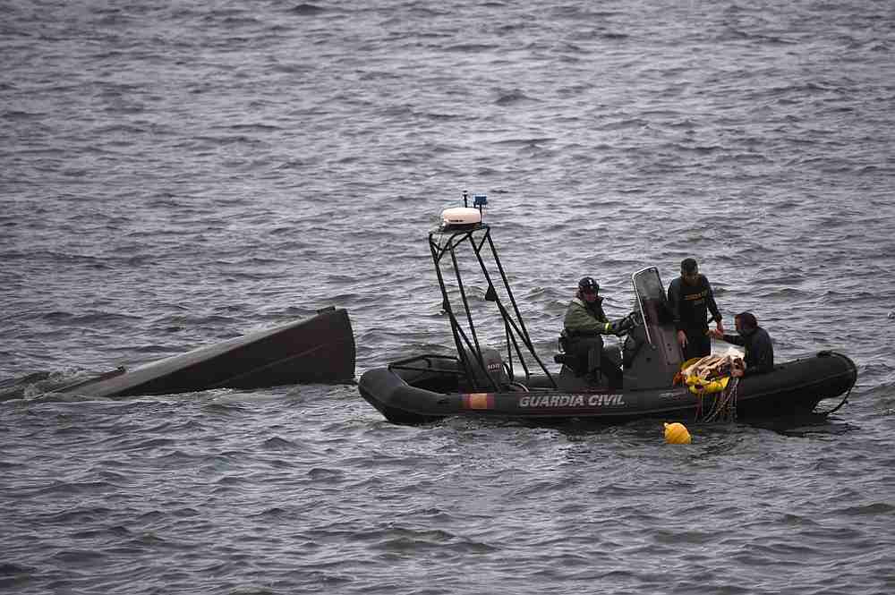Spanish Guardia Civil's divers work to refloat a submarine used to transport drugs illegally in Aldan, northwestern Spain November 25, 2019. u00e2u20acu201d AFP pic
