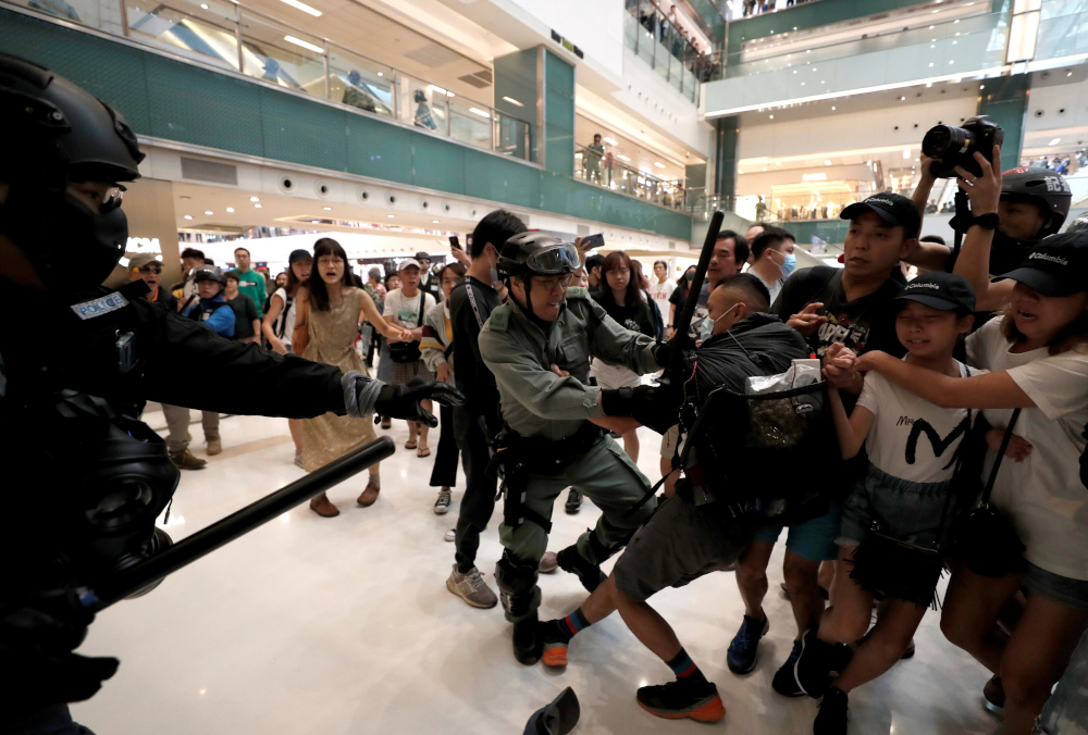Police officers hit a man as shoppers and anti-government protesters gather at New Town Plaza in Sha Tin, Hong Kong, China November 3, 2019. u00e2u20acu201d Reuters pic 