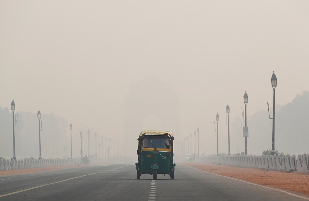 An auto-rickshaw moves past the India Gate on a smoggy morning in New Delhi November 11, 2019. u00e2u20acu201d Reuters pic