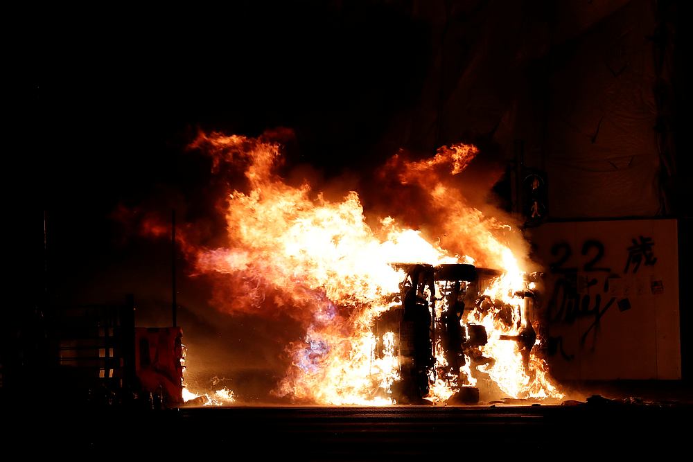 A burning vehicle is seen during a protest in Tseung Kwan O, Hong Kong November 11, 2019. u00e2u20acu201d Reuters pic