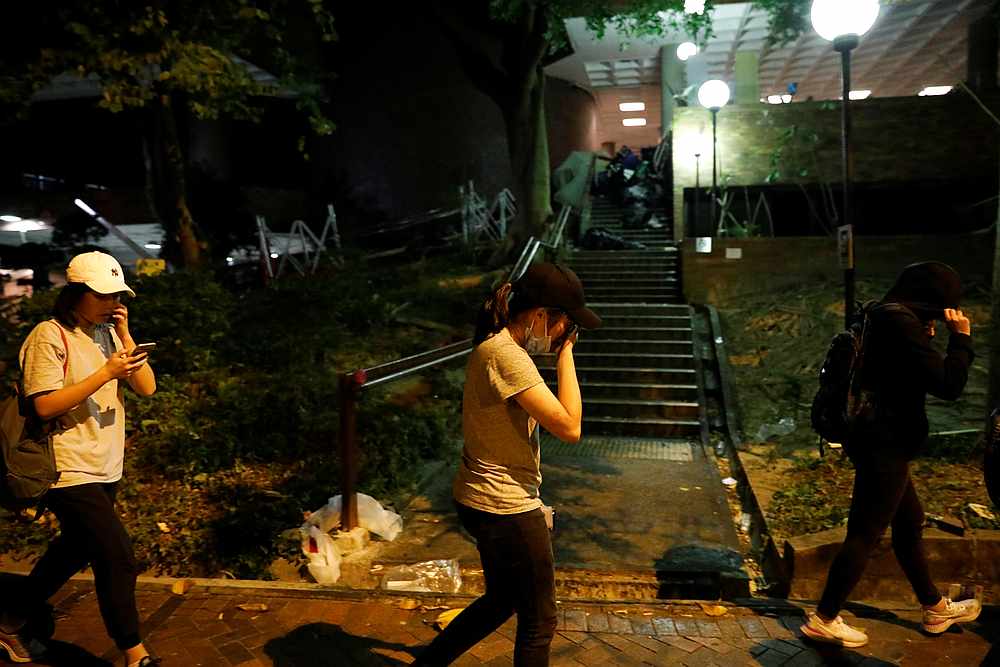 A protester cries as she walks towards the police to surrender, at the Hong Kong Polytechnic University (PolyU) November 19, 2019. u00e2u20acu201d Reuters pic