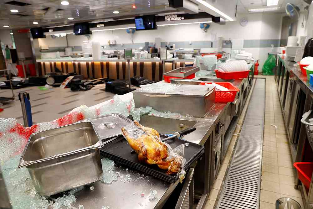 A chicken is seen among debris at a cafeteria in Hong Kong Polytechnic University (PolyU) in Hong Kong November 20, 2019. u00e2u20acu201d Reuters pic