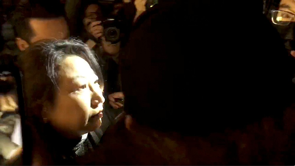 Hong Kong Justice Secretary Teresa Cheng walks as protesters surround her in London, Britain November 14, 2019. u00e2u20acu201d Chloe Leung/Video still image via Reuters
