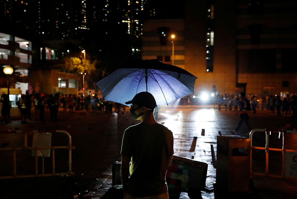 An anti-government protester holds an umbrella during a protest following 22 year-old University studentu00e2u20acu2122s fall and who was critically injured last weekend, in Tseung Kwan O, Hong Kong, November 5, 2019. u00e2u20acu201d Reuters pic