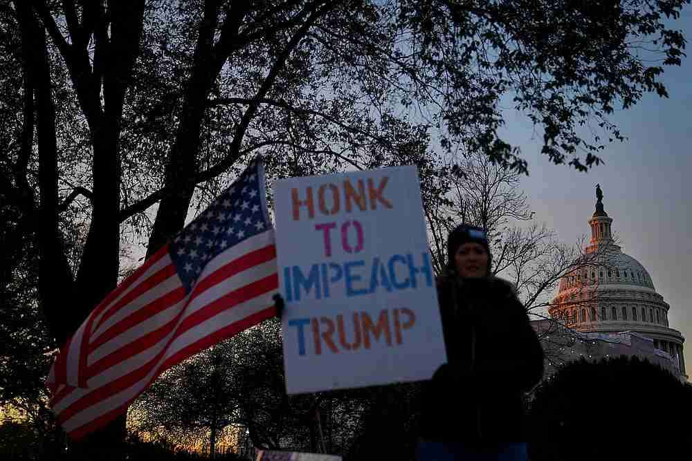 Christina Young holds a 'Honk to Impeach Trump' sign outside of Longworth House Office Building in Washington November 15, 2019. u00e2u20acu201d Reuters pic