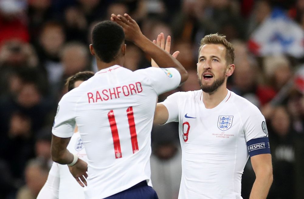 England's Harry Kane celebrates with teammate Marcus Rashford after scoring their second goal against Montenegro. u00e2u20acu201d Reuters pic