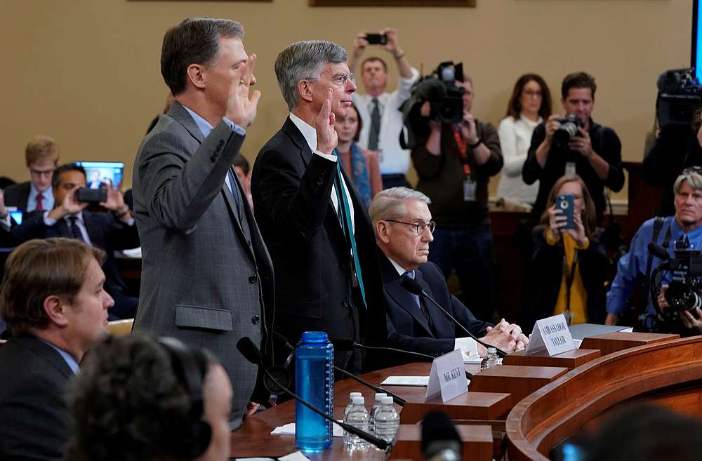 George Kent (left), the deputy assistant secretary of state, and William Taylor, the top US diplomat in Ukraine, are sworn in during the public hearing on Capitol Hill in Washington November 13, 2019. u00e2u20acu201d Reuters pic
